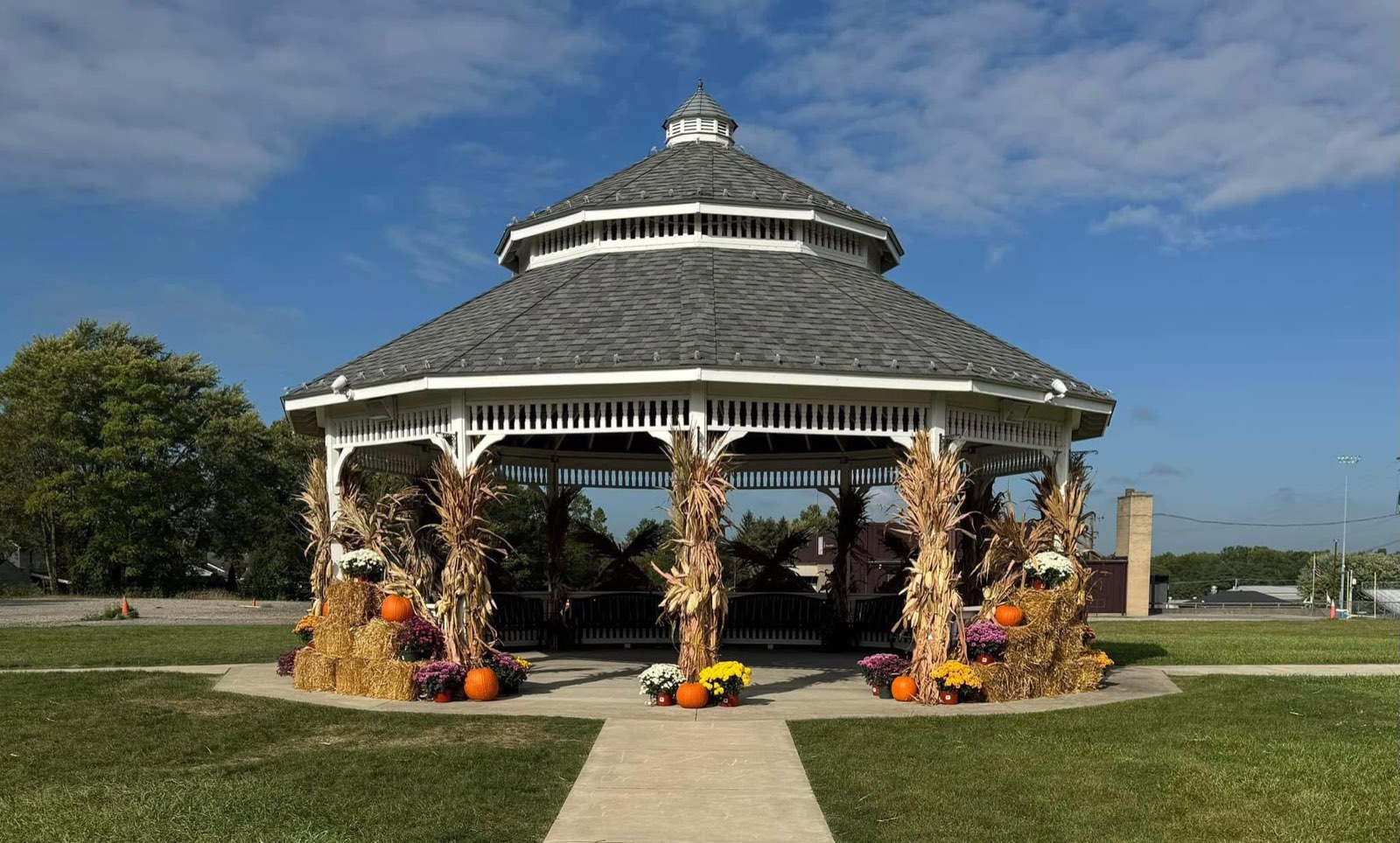 The gazebo at Weathersfield Community Park decorated for fall with hay bales, pumpkins, and corn stalks